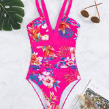 Nessa floral charm swimsuit with V-neckline and floral print in multiple colours
