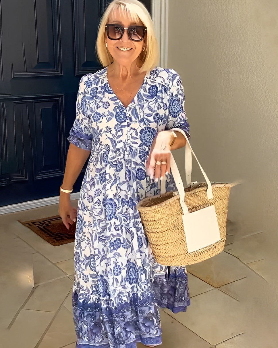 Keisha graceful V-neck floral dress shown in a soft feminine silhouette