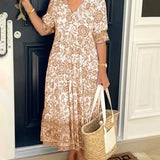 Keisha graceful V-neck floral dress shown in a soft feminine silhouette