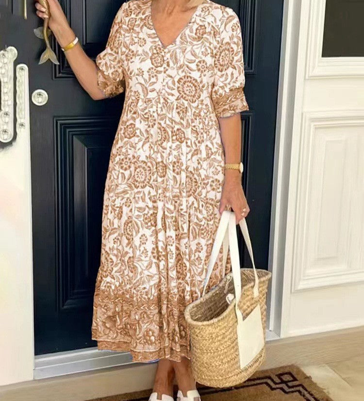 Keisha graceful V-neck floral dress shown in a soft feminine silhouette
