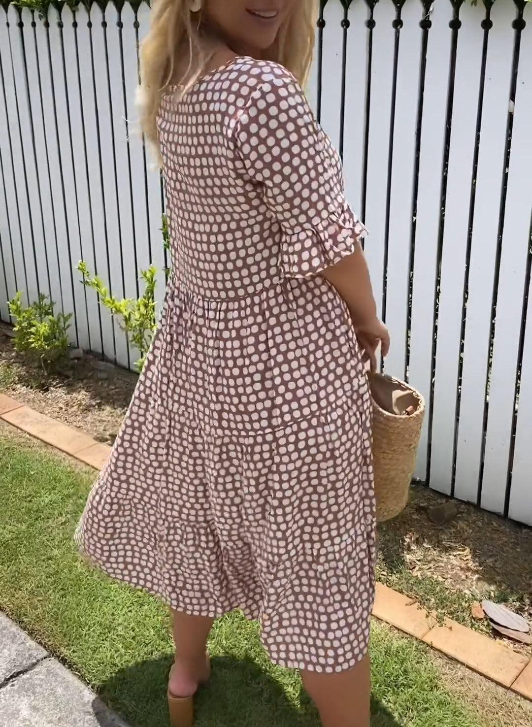 Zora short-sleeve summer midi dress in a relaxed, flowing silhouette