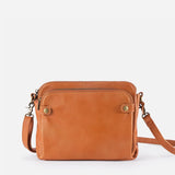 Kaya's Jewel full-grain leather shoulder bag shown in brown, blue, black and green