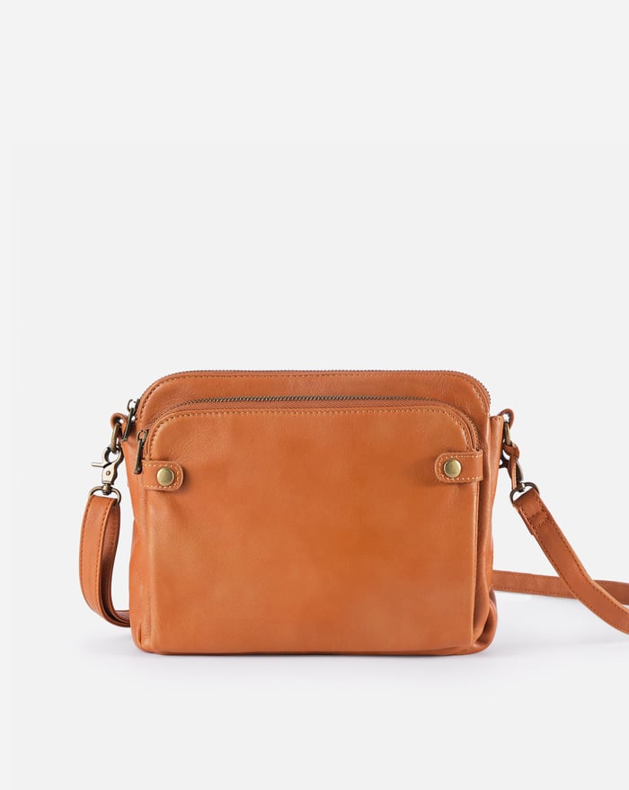 Kaya's Jewel full-grain leather shoulder bag shown in brown, blue, black and green