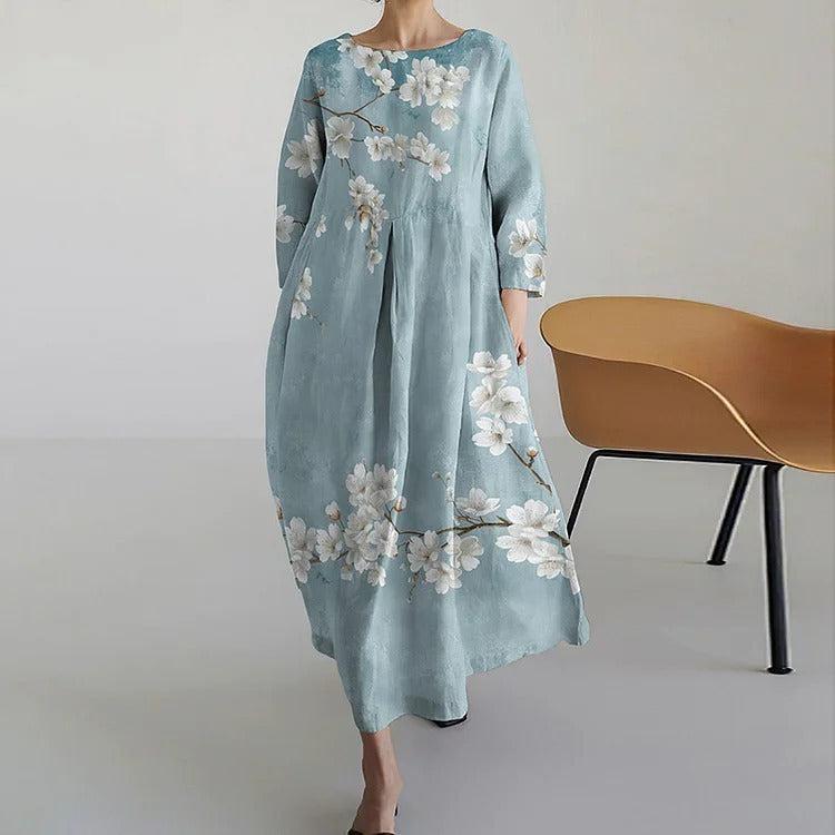 Cherie light blue A-line maxi dress with 3/4 sleeves and flowing floor-length skirt