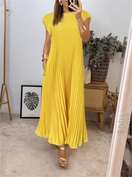 Sandra pleated elegant dress with relaxed flowy fit and pockets, shown in a solid colour