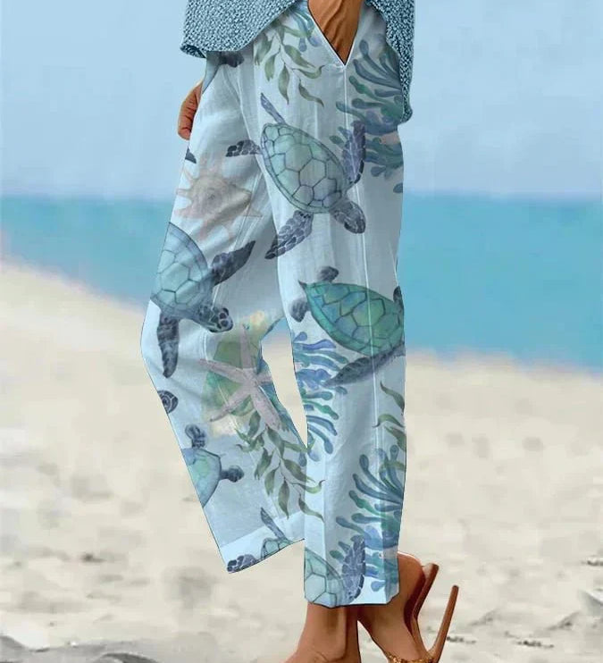 Sally relaxed casual pants with floral and turtle print in a light, easy-going colour
