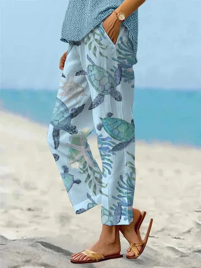 Sally relaxed casual pants with floral and turtle print in a light, easy-going colour