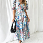 Daliah graceful floral dress with flowing silhouette in green and blue