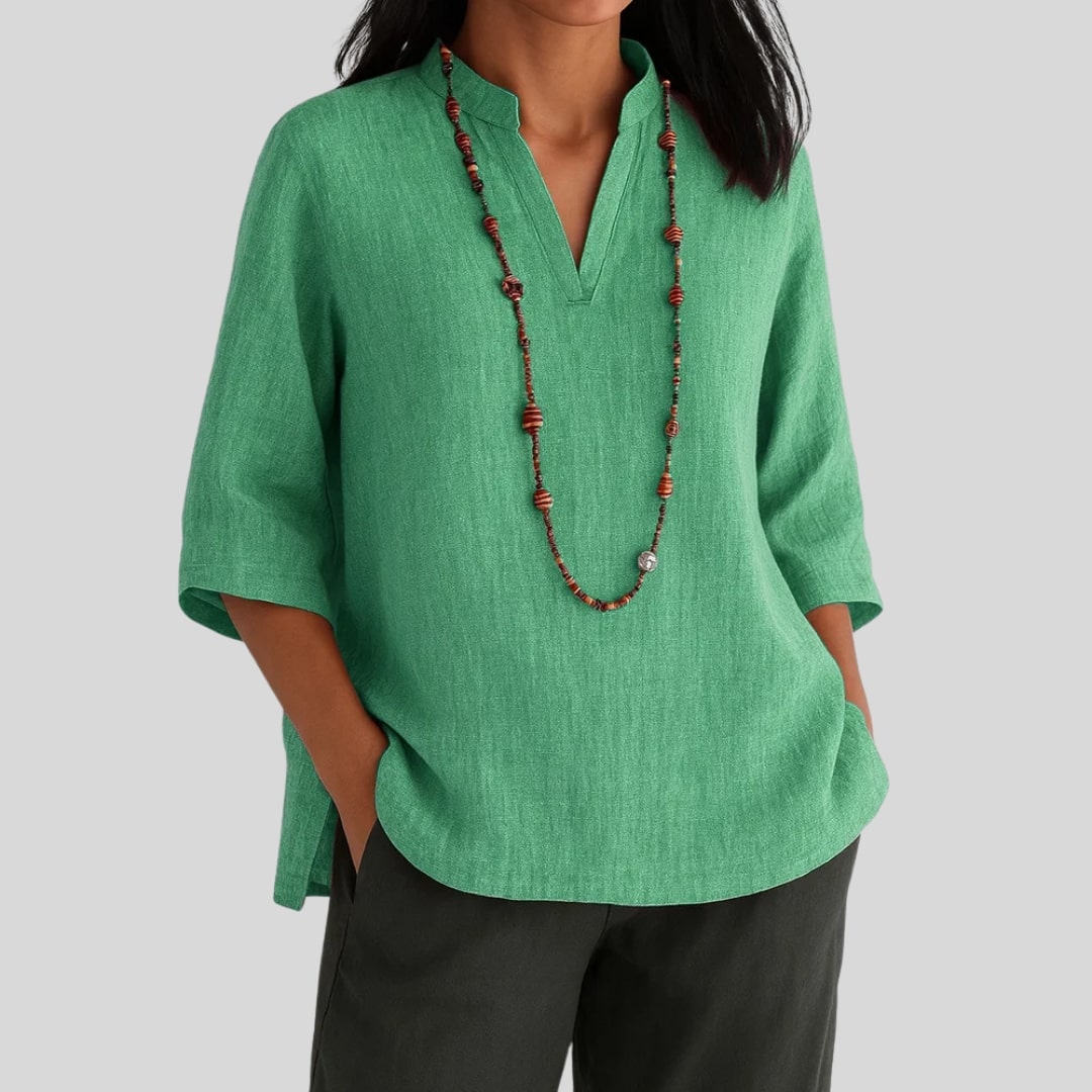 Elira chic everyday blouse with split V-neckline, three-quarter sleeves and peplum hem