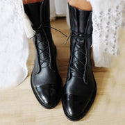 Andrea heeled boots shown in black and brown with a sleek modern silhouette
