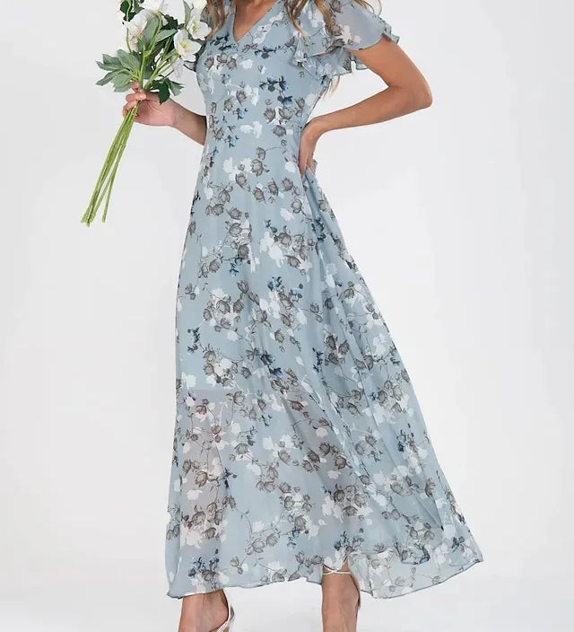 Zuri glamorous tummy-flattering dress in vibrant colour, styled for summer occasions
