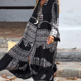 Emy black V-neck dress with elegant bell sleeves and soft flowy drape