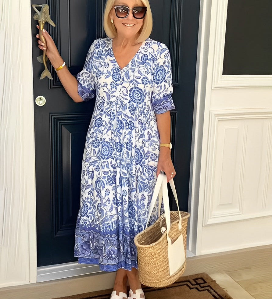 Keisha graceful V-neck floral dress shown in a soft feminine silhouette