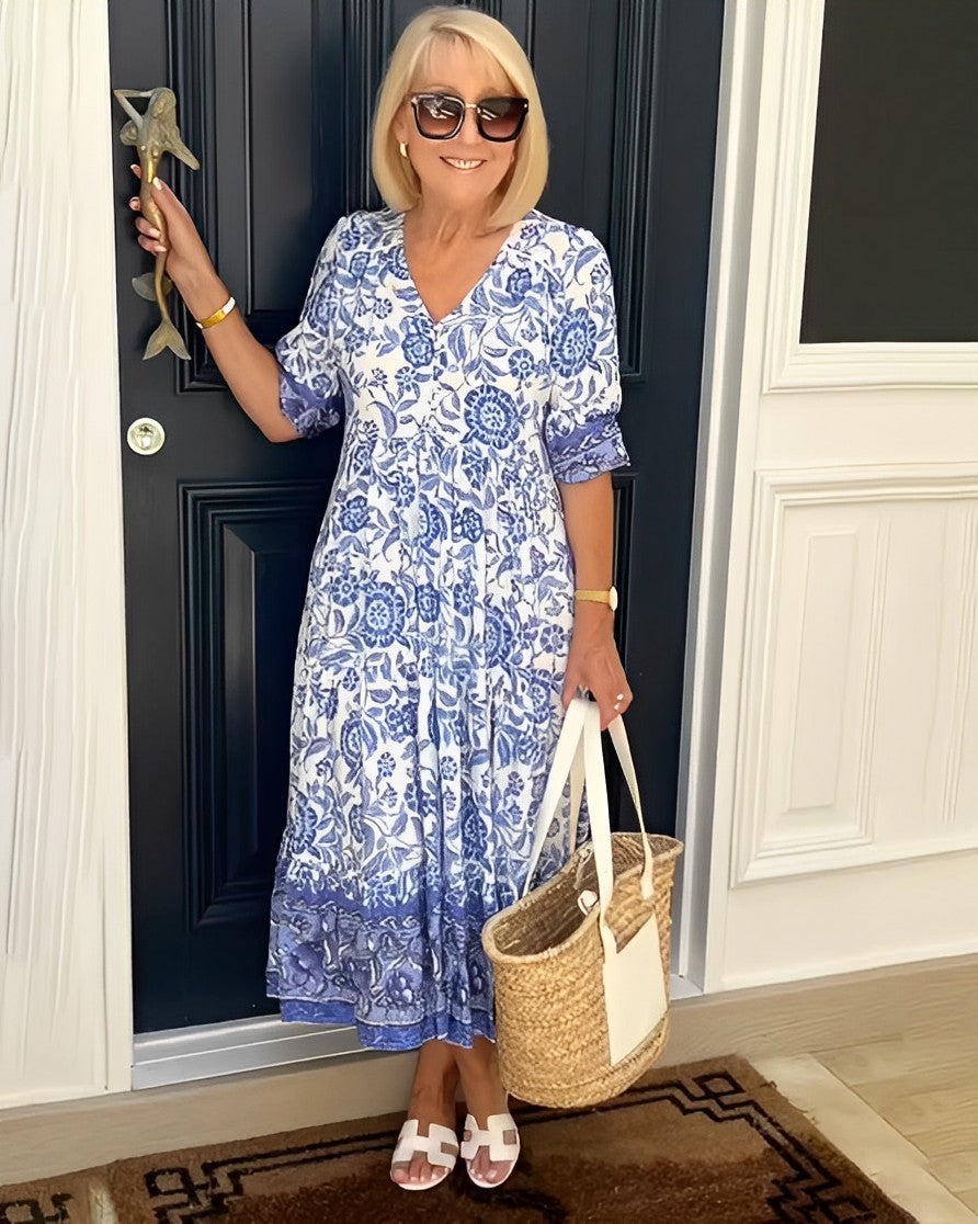 Keisha graceful V-neck floral dress shown in a soft feminine silhouette