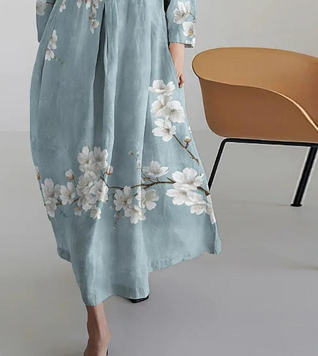 Cherie light blue A-line maxi dress with 3/4 sleeves and flowing floor-length skirt
