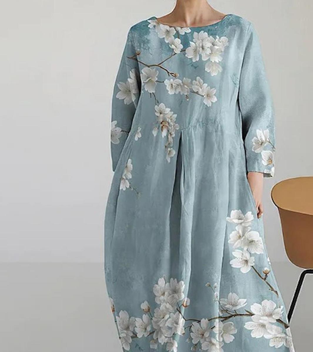 Cherie light blue A-line maxi dress with 3/4 sleeves and flowing floor-length skirt