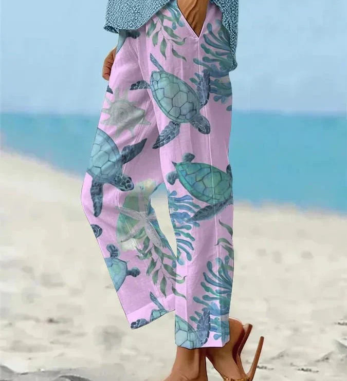 Sally relaxed casual pants with floral and turtle print in a light, easy-going colour