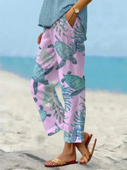 Sally relaxed casual pants with floral and turtle print in a light, easy-going colour