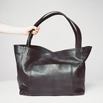 Sunset Luxe leather shoulder bag shown in brown, wine and black