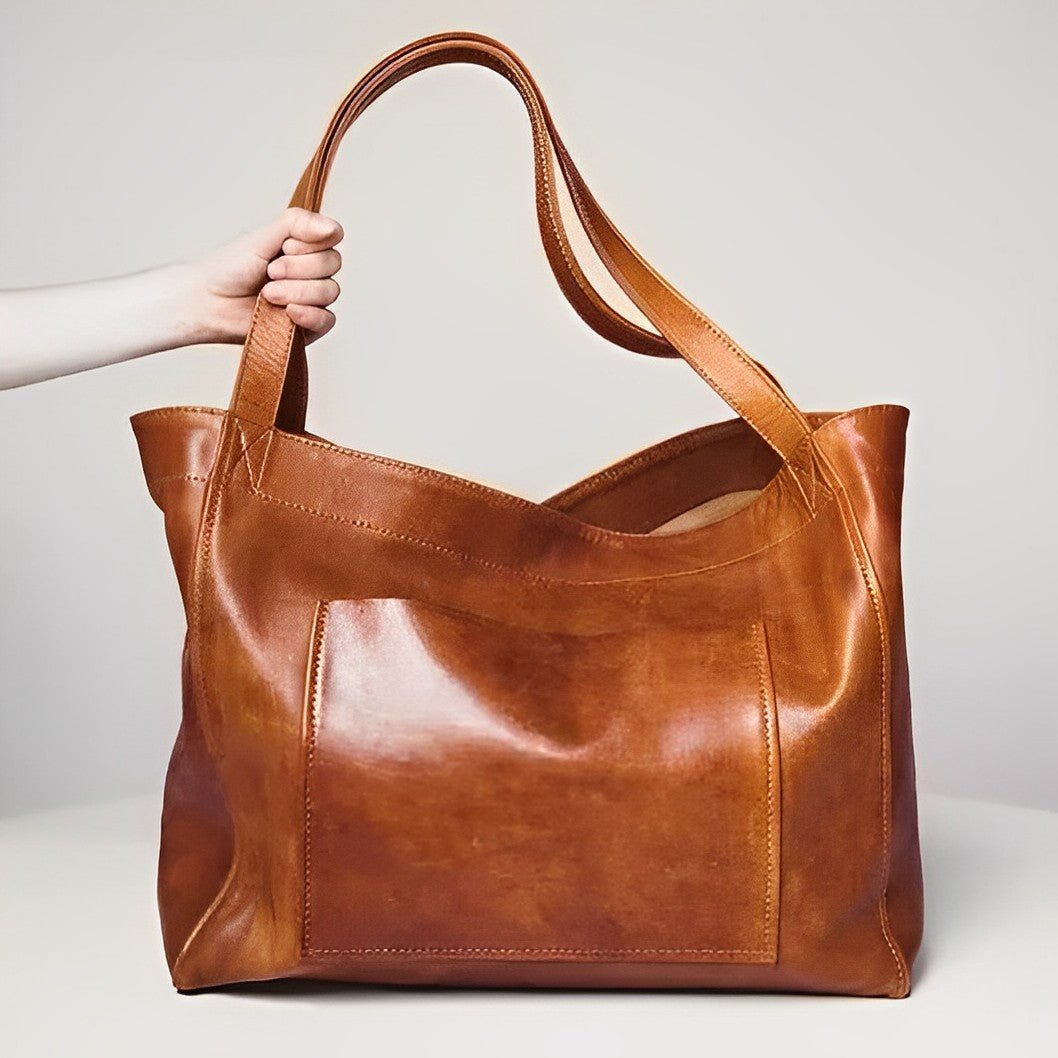 Sunset Luxe leather shoulder bag shown in brown, wine and black