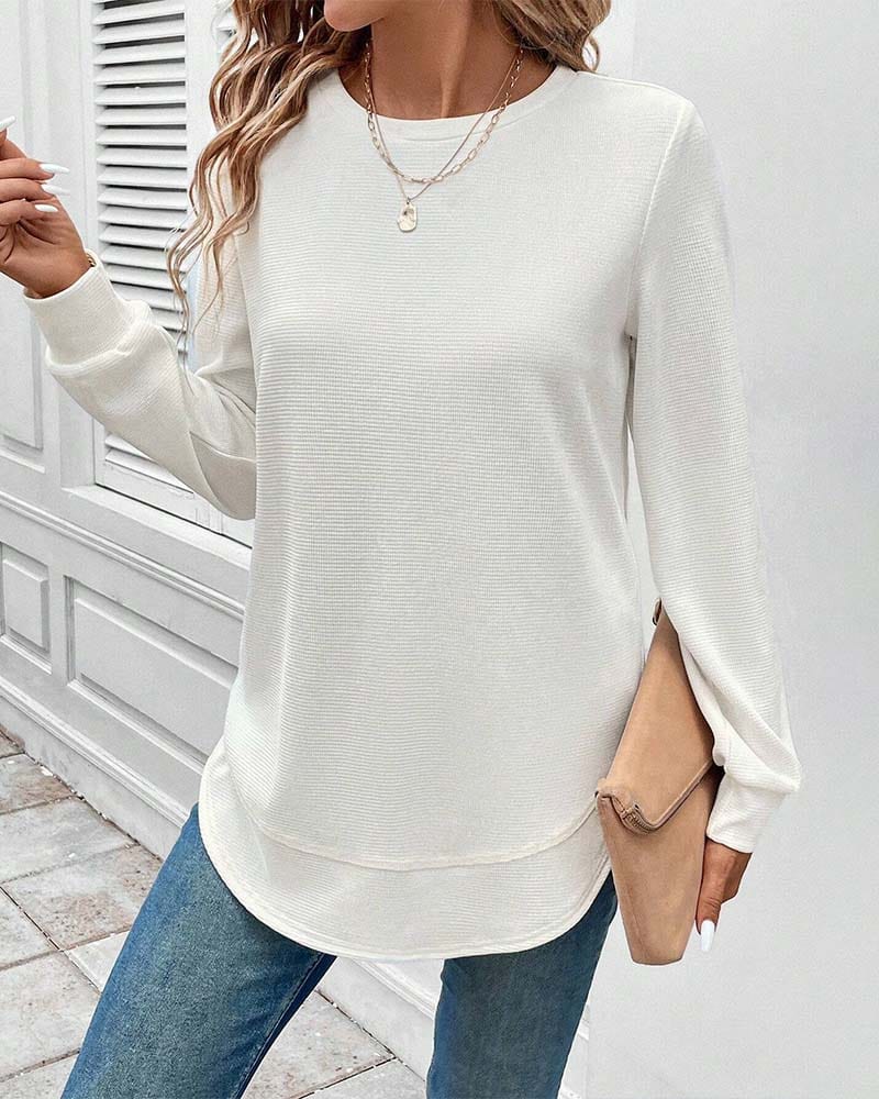 Ynes graceful long sleeve top with a classic round neck and regular fit