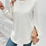 Ynes graceful long sleeve top with a classic round neck and regular fit