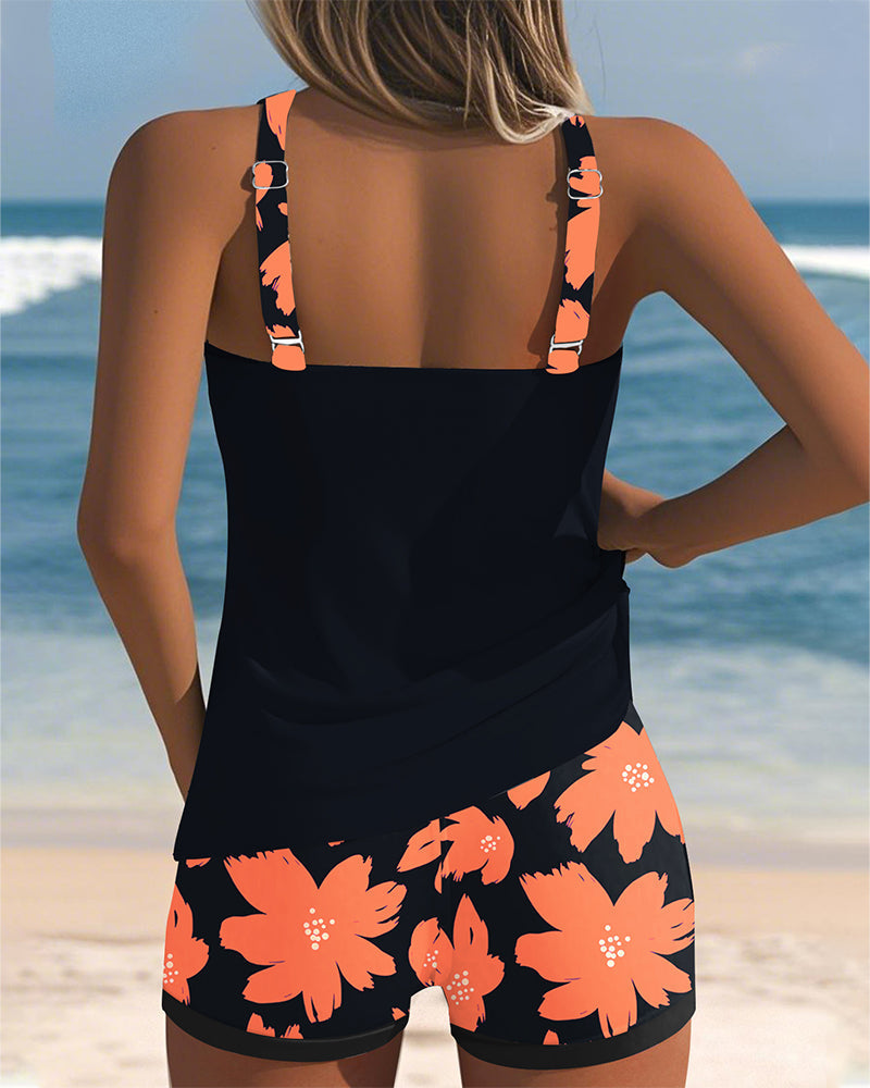 Edith sleeveless printed tankini with U-neck and open back in navy, orange and blue