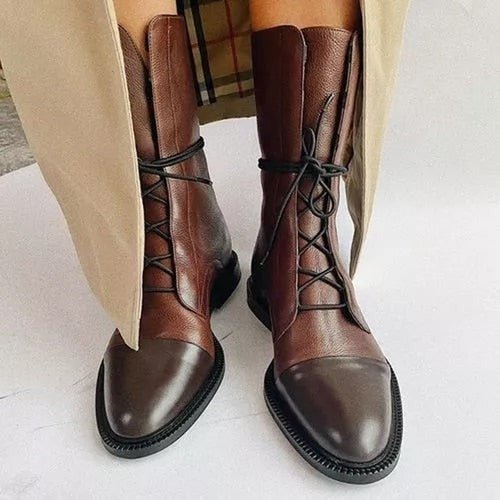 Andrea heeled boots shown in black and brown with a sleek modern silhouette
