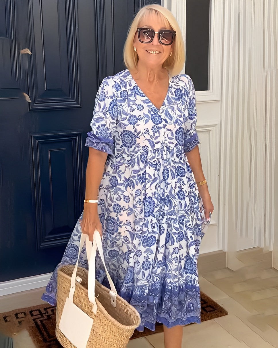 Keisha graceful V-neck floral dress shown in a soft feminine silhouette