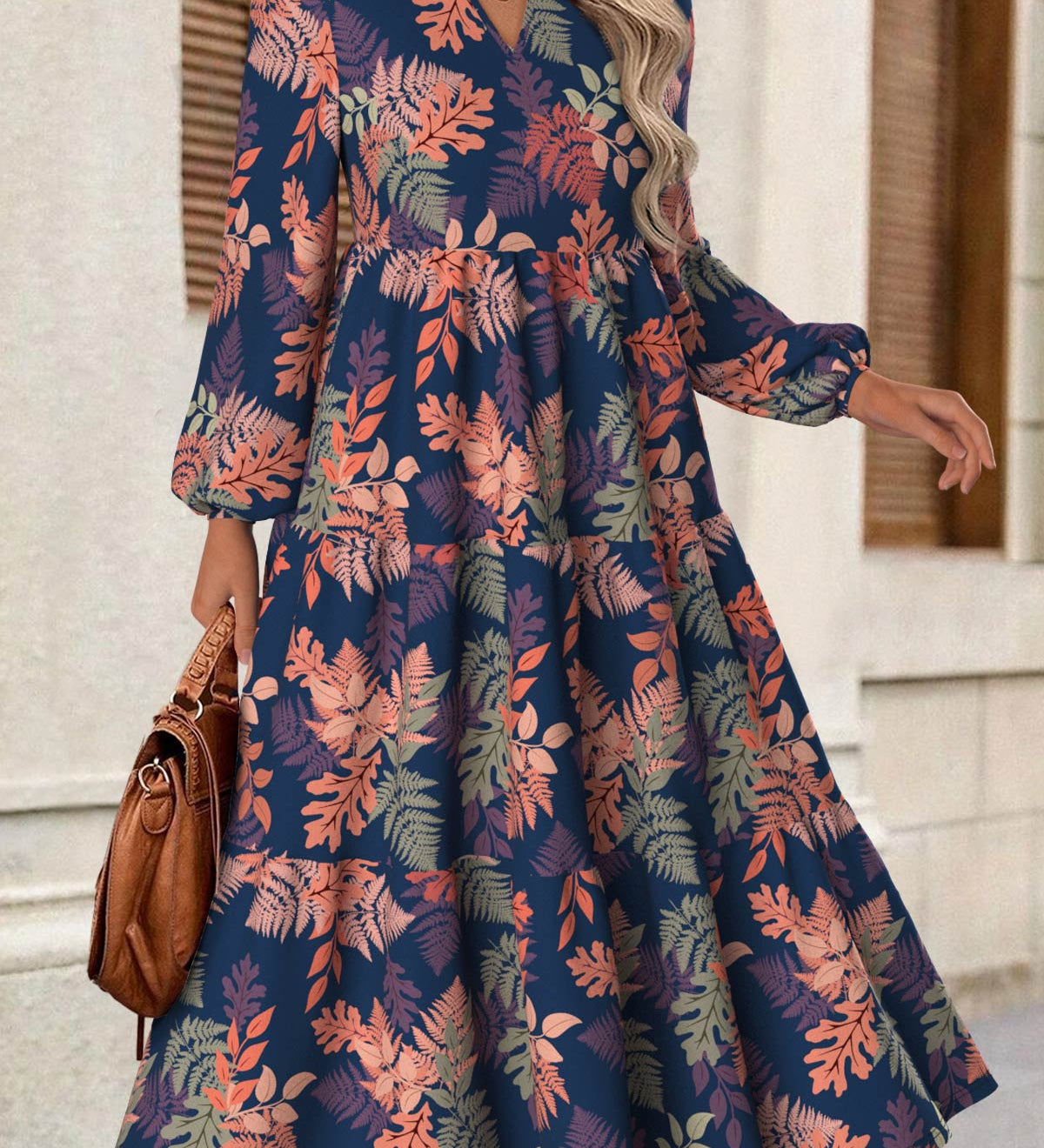 Rina floral dress with flowy silhouette, long puff sleeves and split neckline