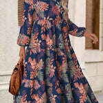 Rina floral dress with flowy silhouette, long puff sleeves and split neckline