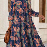 Rina floral dress with flowy silhouette, long puff sleeves and split neckline