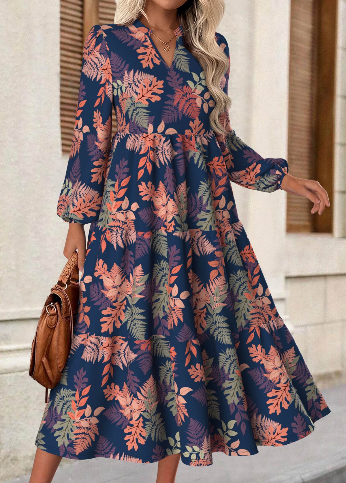Rina floral dress with flowy silhouette, long puff sleeves and split neckline