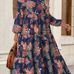 Rina floral dress with flowy silhouette, long puff sleeves and split neckline