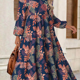 Rina floral dress with flowy silhouette, long puff sleeves and split neckline