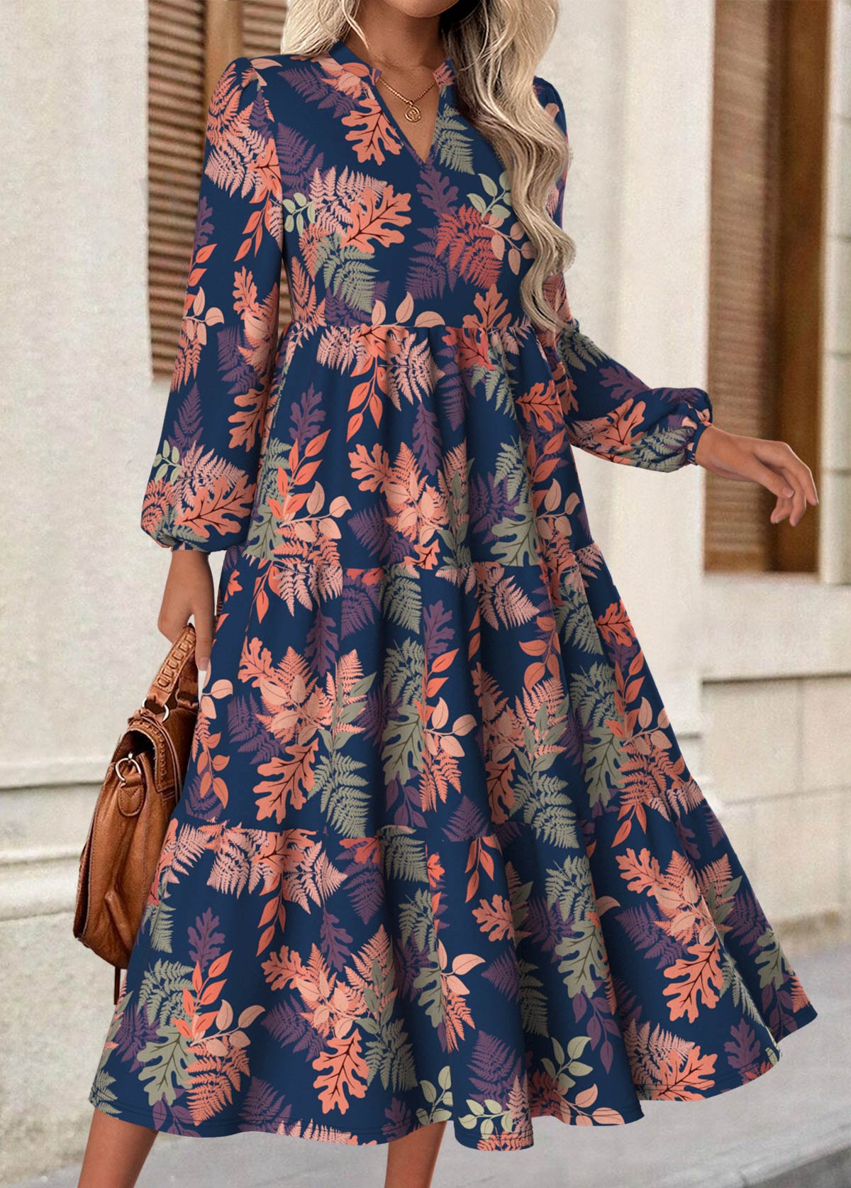 Rina floral dress with flowy silhouette, long puff sleeves and split neckline