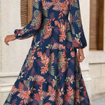 Rina floral dress with flowy silhouette, long puff sleeves and split neckline