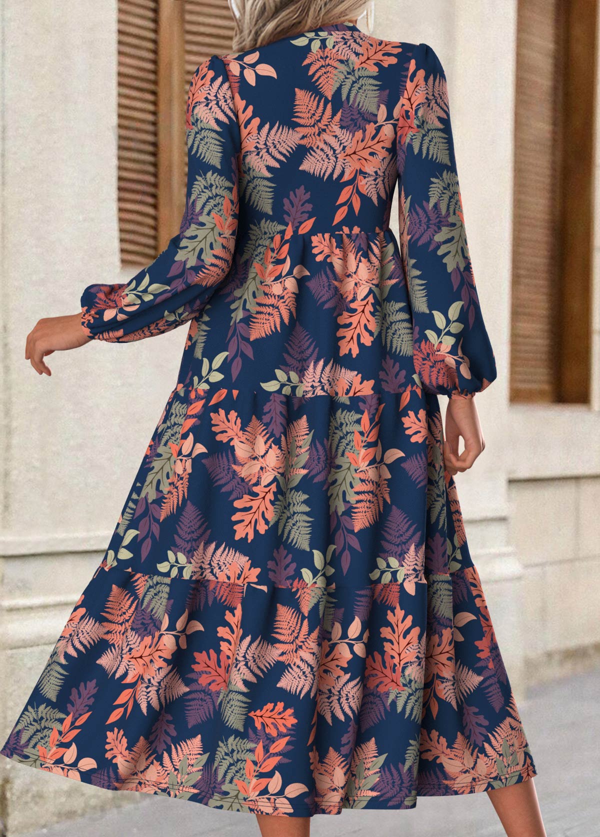 Rina floral dress with flowy silhouette, long puff sleeves and split neckline