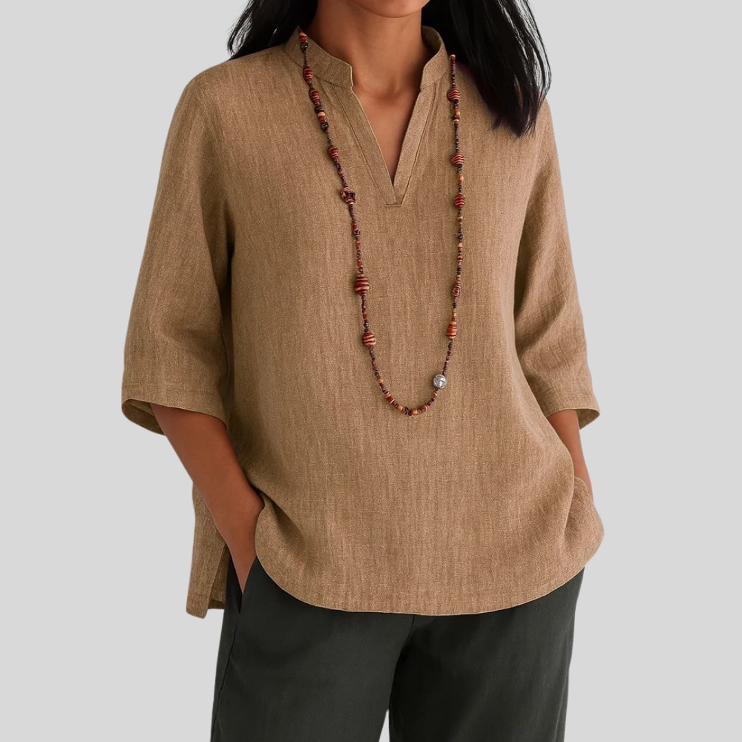Elira chic everyday blouse with split V-neckline, three-quarter sleeves and peplum hem