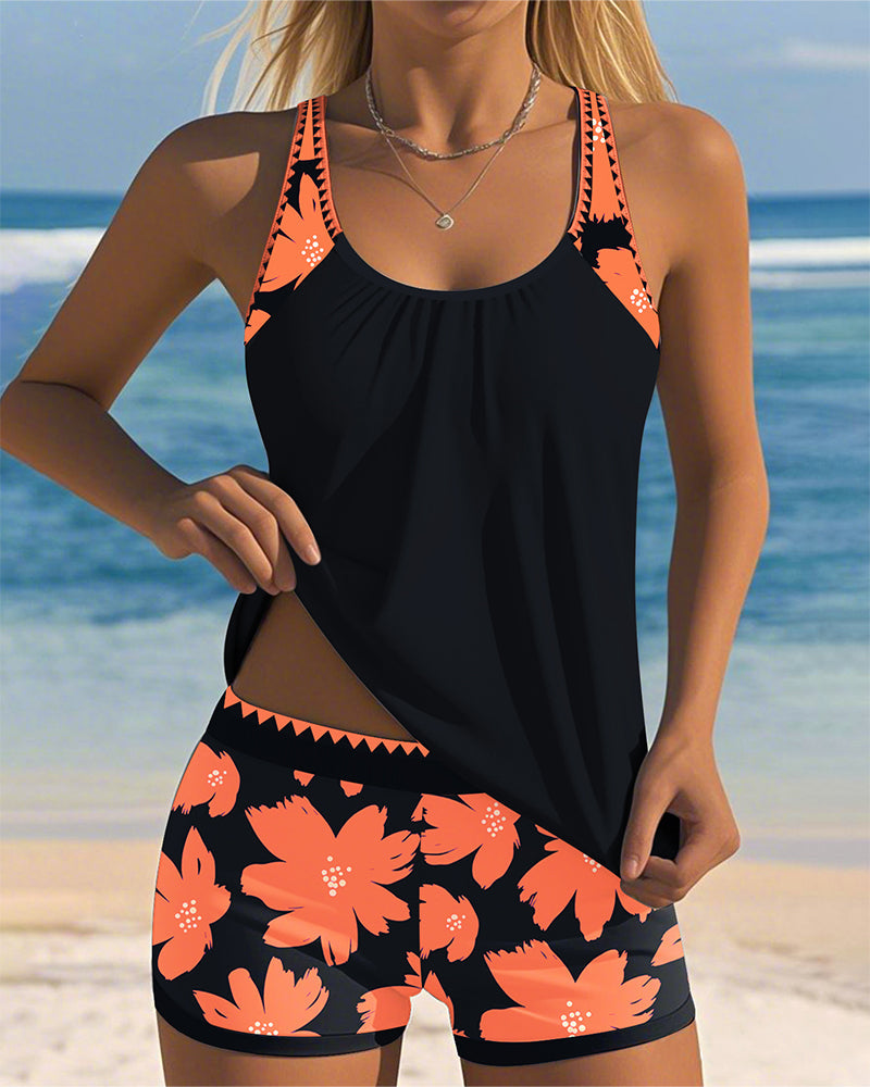 Edith sleeveless printed tankini with U-neck and open back in navy, orange and blue