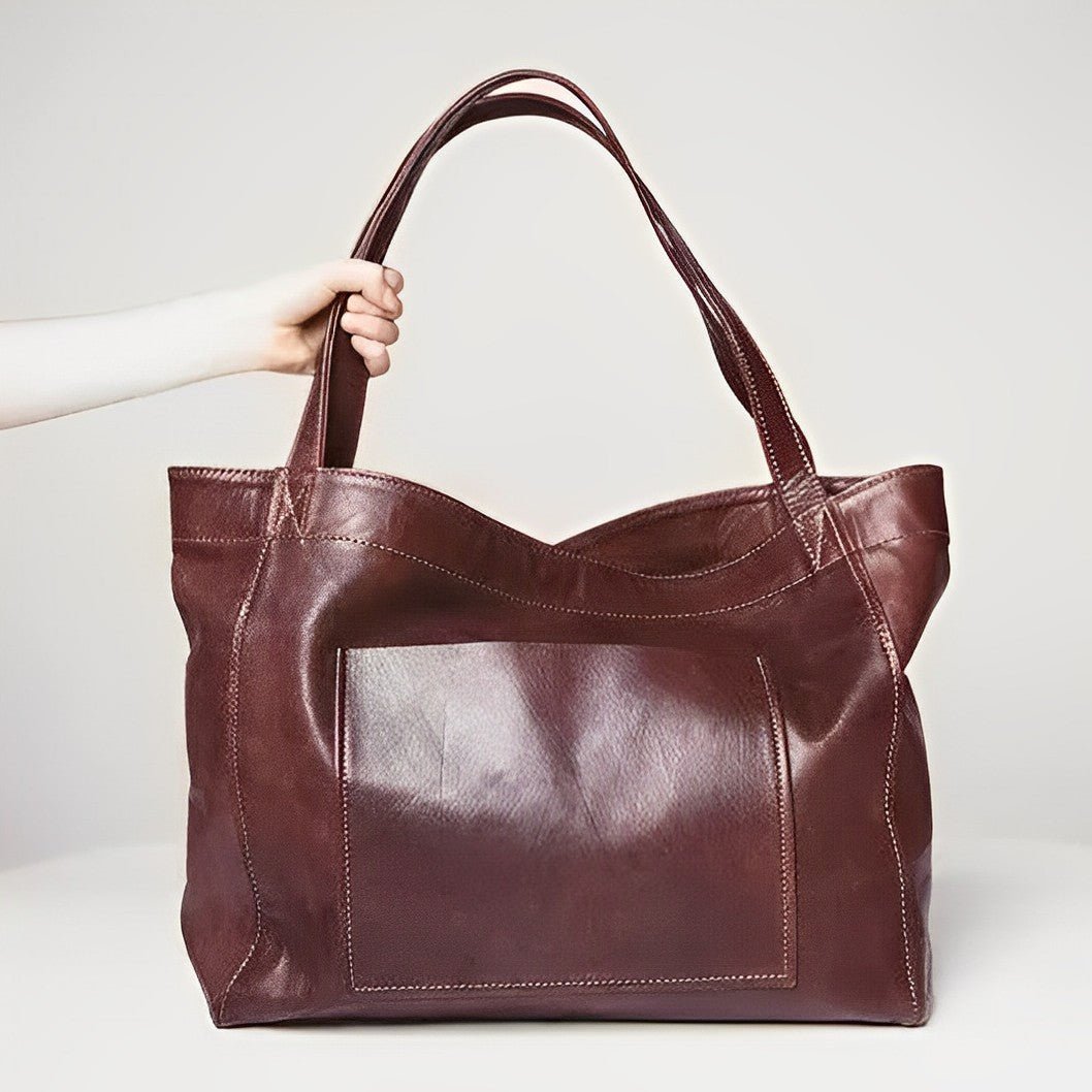 Sunset Luxe leather shoulder bag shown in brown, wine and black