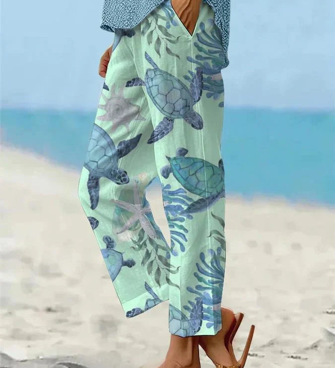 Sally relaxed casual pants with floral and turtle print in a light, easy-going colour