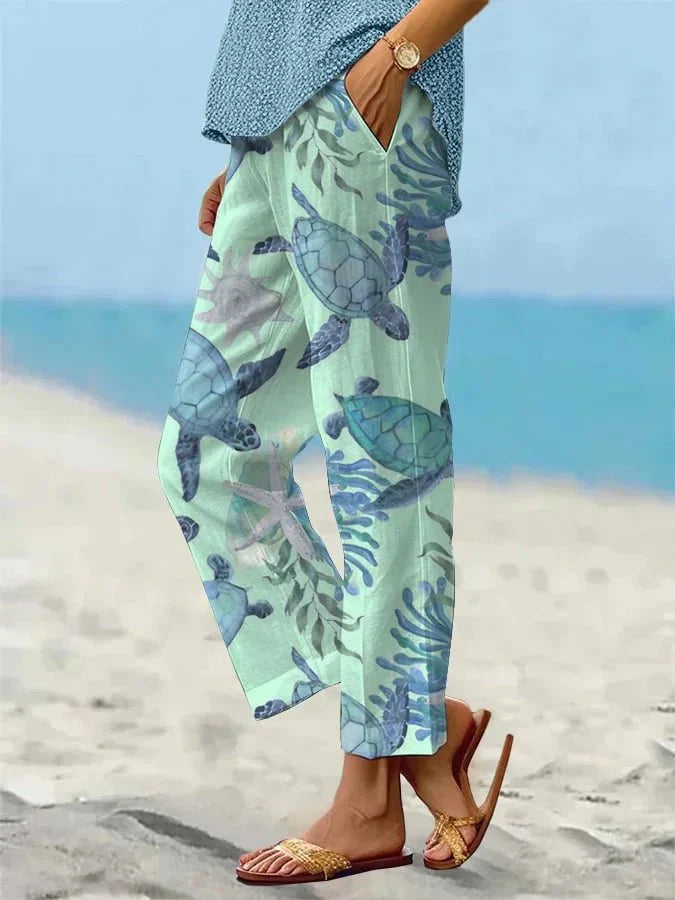 Sally relaxed casual pants with floral and turtle print in a light, easy-going colour