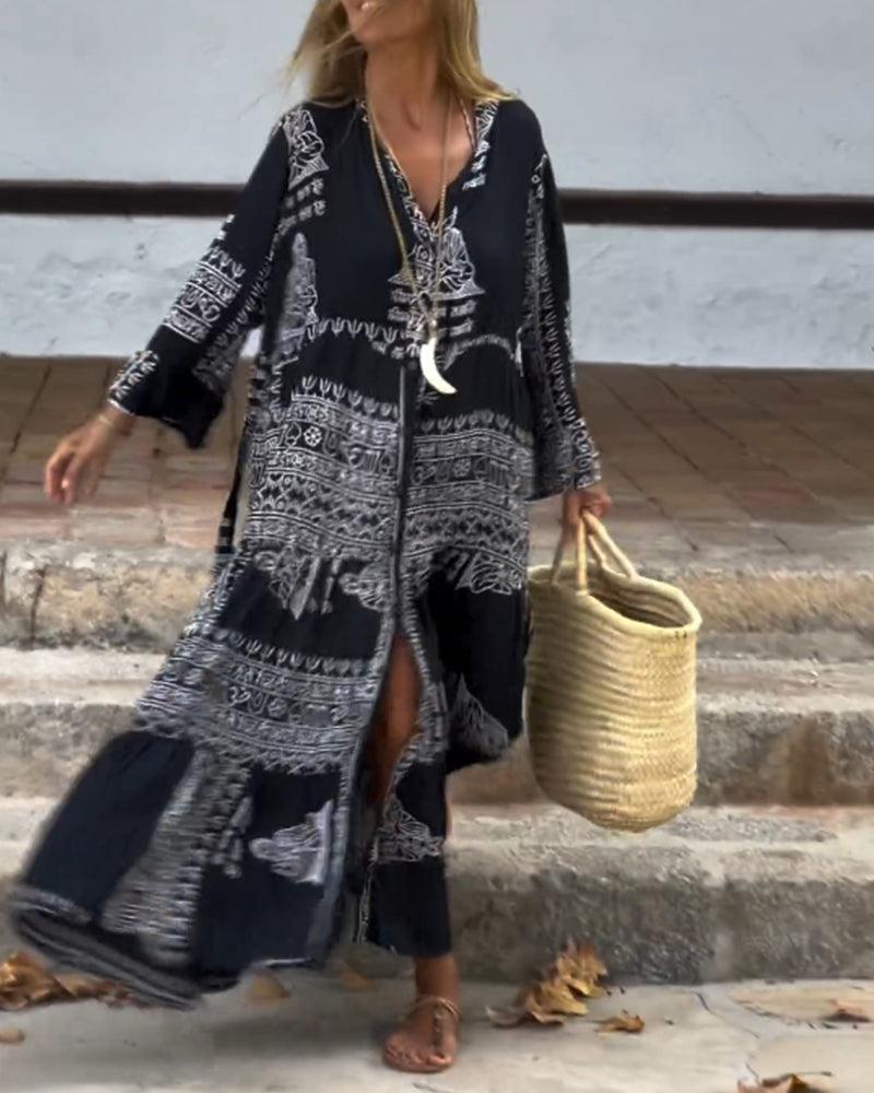Emy black V-neck dress with elegant bell sleeves and soft flowy drape