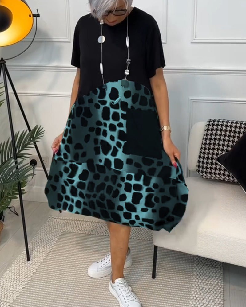 Cassandra women's elegant relaxed-fit midi dress with deep side pockets in a black and stone print