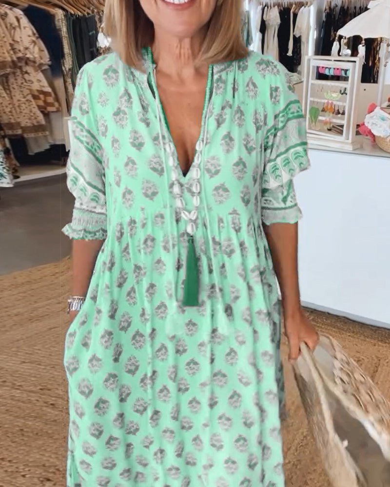 Mana floral v-neck dress shown in blue, green and pink