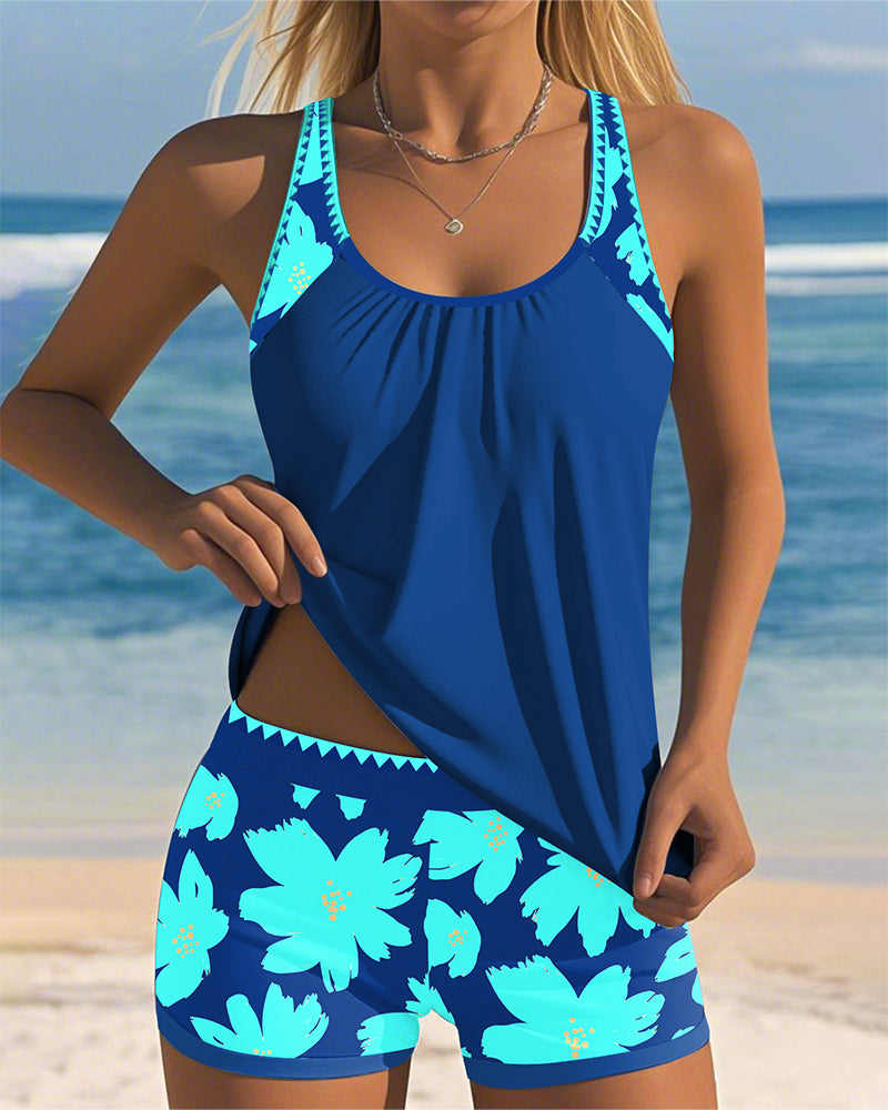 Edith sleeveless printed tankini with U-neck and open back in navy, orange and blue