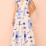 Avermy blue floral maxi dress with V-neckline and puff sleeves
