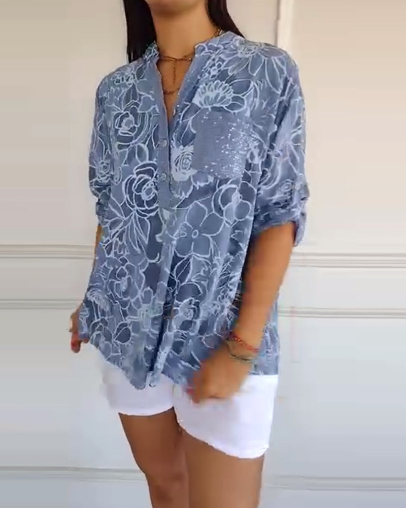 Sade floral print blouse with a relaxed, flowing silhouette in light blue