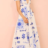 Avermy blue floral maxi dress with V-neckline and puff sleeves